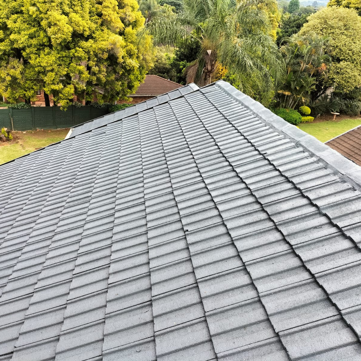 Specialized roof spray painting application on a metal roof in Athlone, Pietermaritzburg.